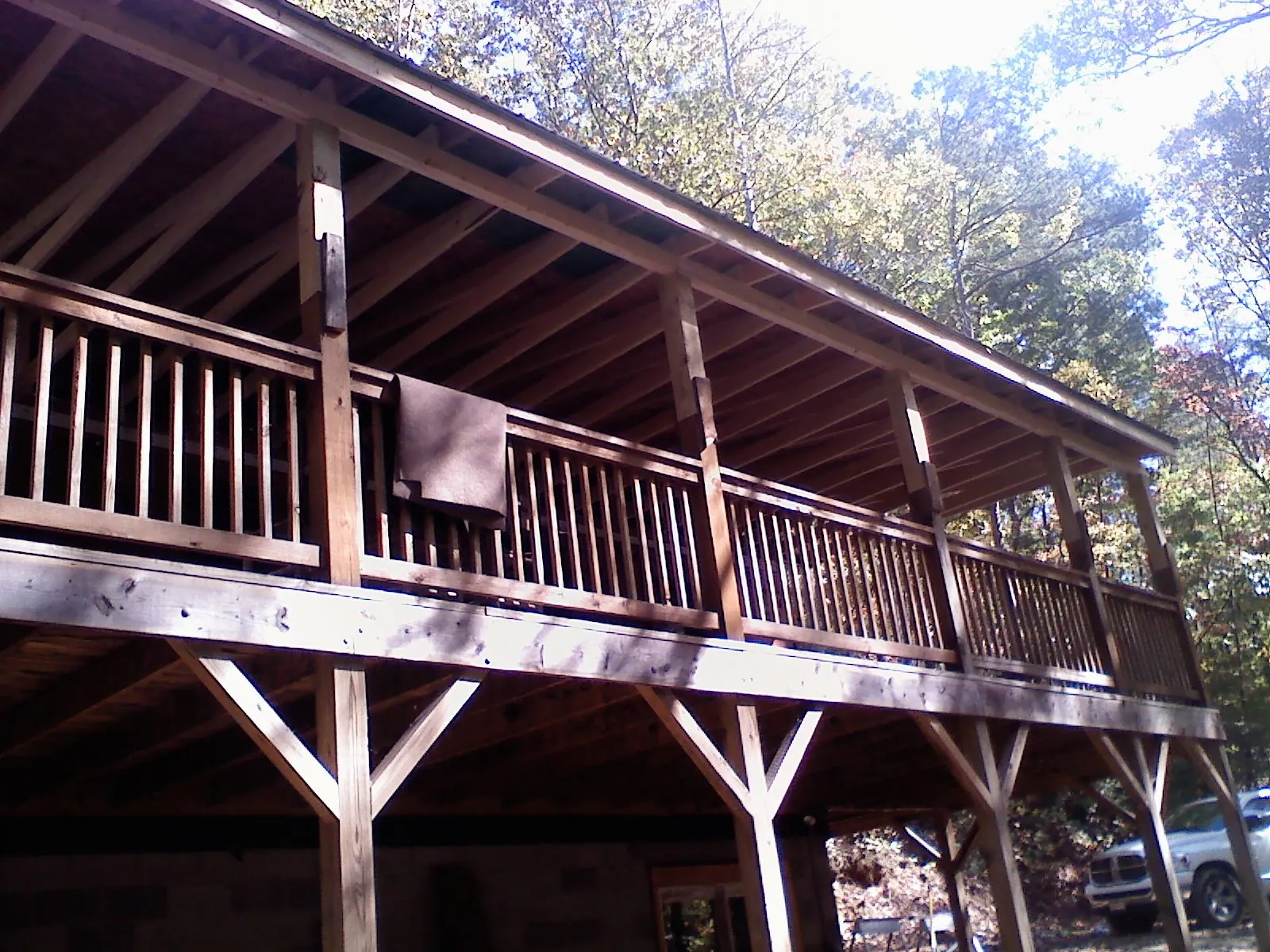 Timber framing under a new elevated porch and deck — Roof Leak Repair in Knowlesville by Roofing Brothers